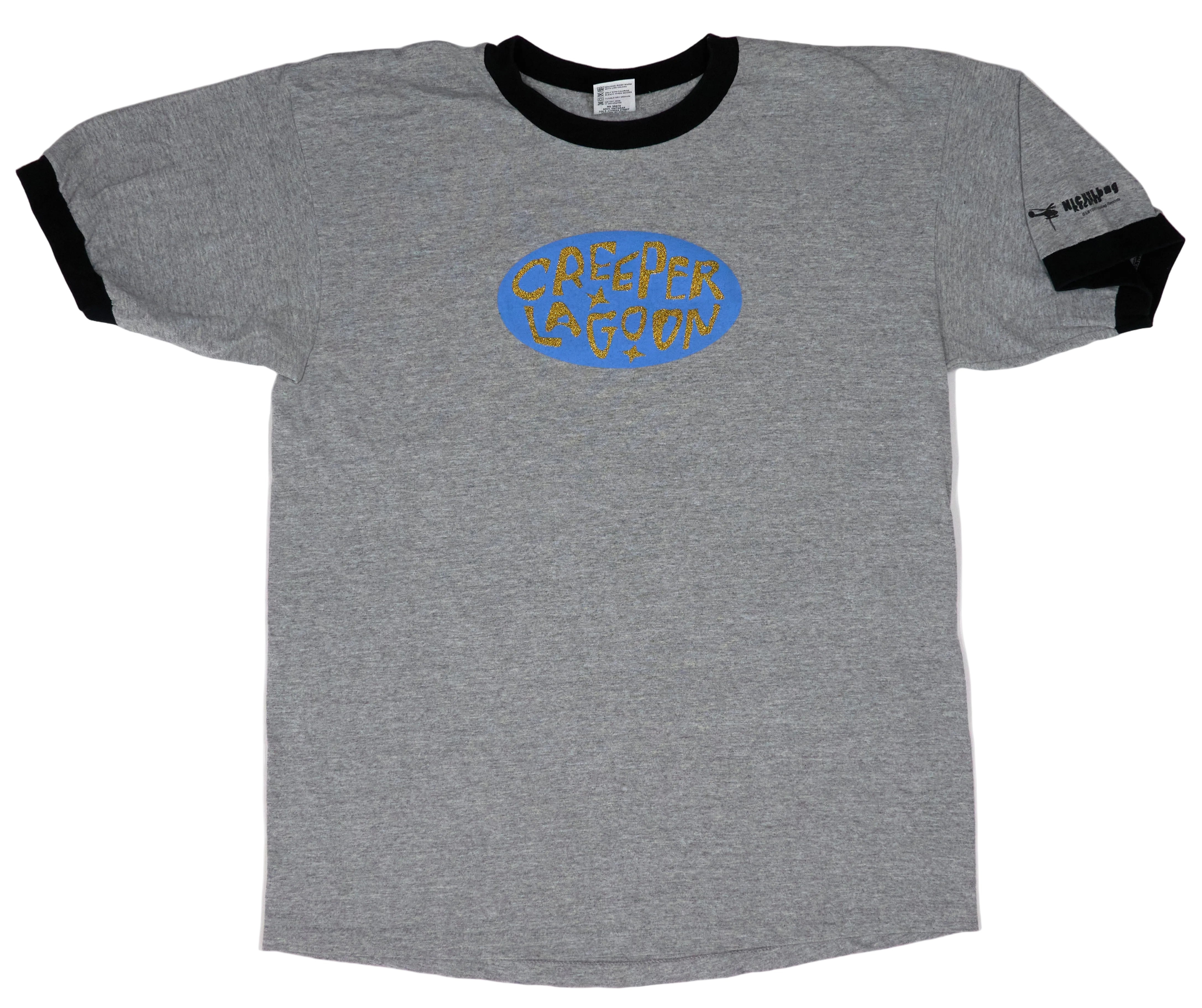 A gray t-shirt with a blue logo on the front, displayed on a white background. The shirt has a black collar and sleeves with the brand name 'CREEPER LAGOON' across the chest.