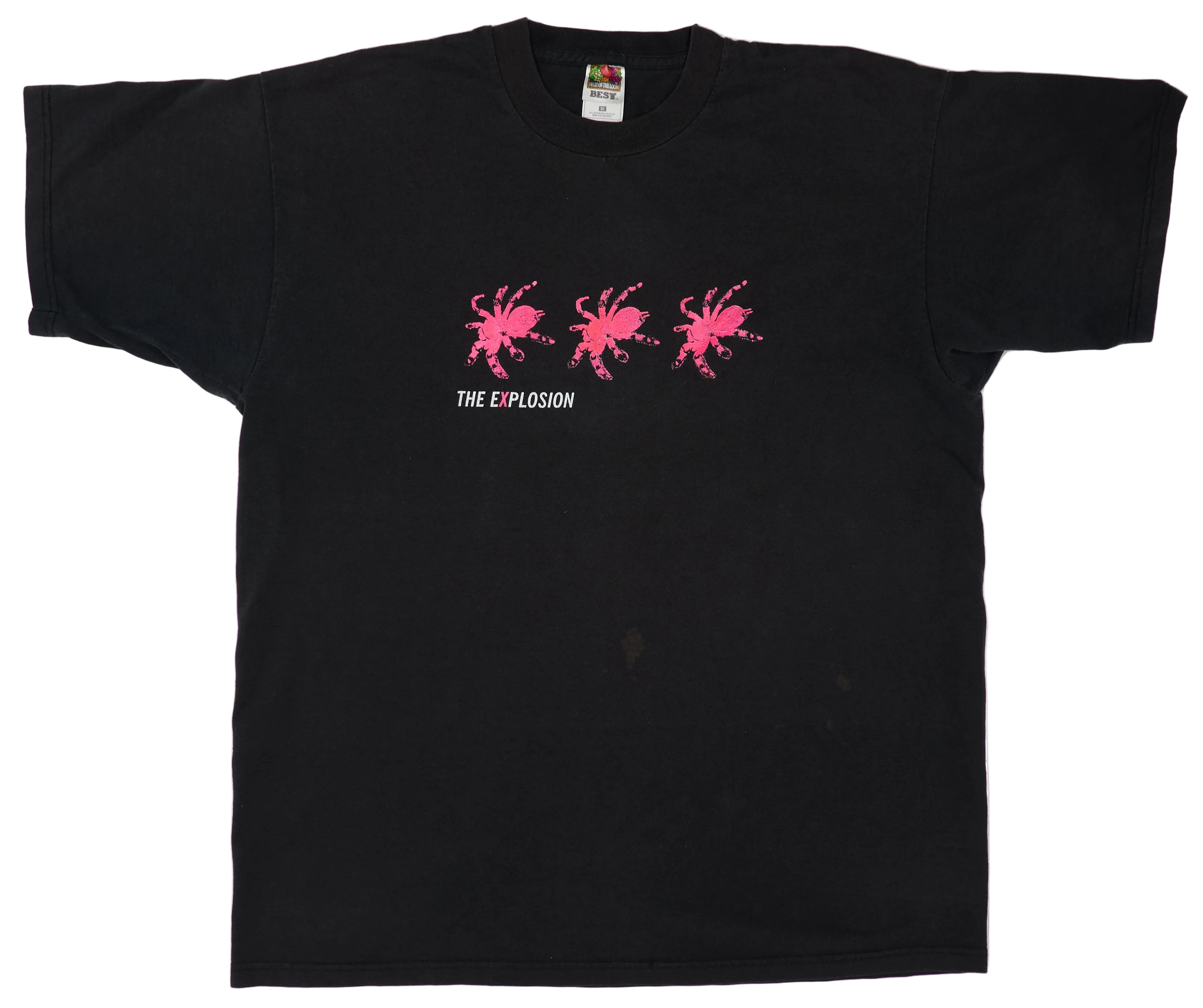A black T-shirt with pink text and graphics, featuring the words 'THE EXPLOSION' and depicting three spider-like figures.